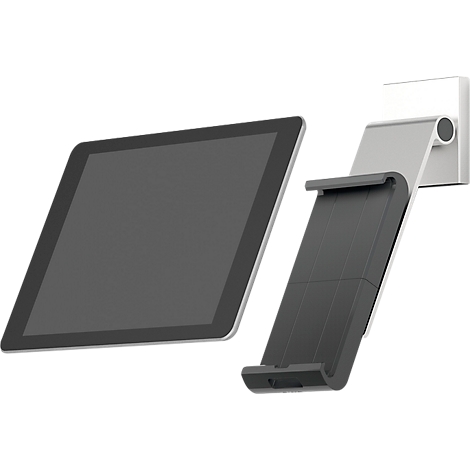 A black tablet next to a bracket for wall mounting. The holder is gray and black.