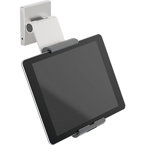 A silver tablet holder with a black tablet in front, attached to a wall mount.