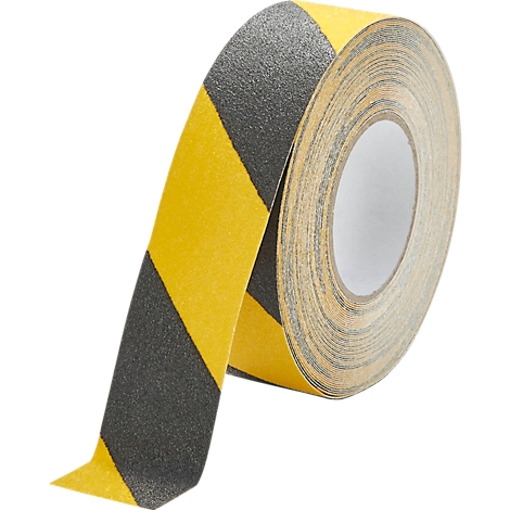 A roll of yellow and black anti-slip tape. The tape is rolled up and partially unrolled, revealing the striped pattern.