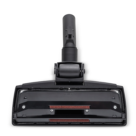 Black vacuum cleaner nozzle. Attachment for cleaning floors, with rollers and brushes.