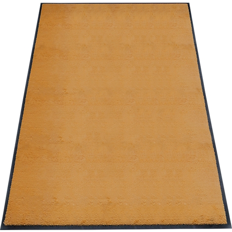 Een beige tapijt met een zwarte rand, schuin van bovenaf gefotografeerd.