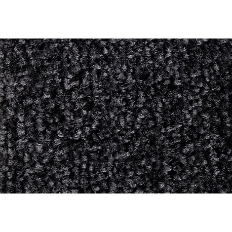 Primer plano de una superficie de alfombra gris texturizada con pelo denso.