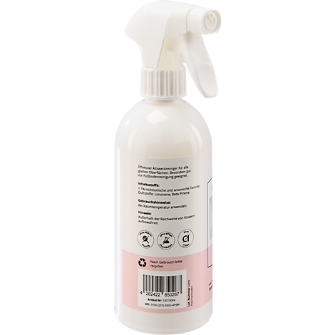 Witte spuitfles met roze etiket, met tekst erop. De sproeikop is bovenop geplaatst.