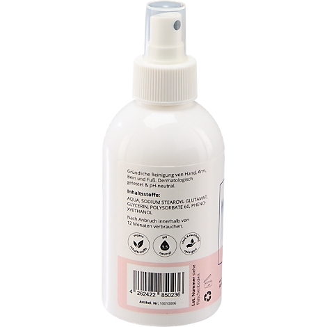 Flacon de pulvérisation blanc avec informations sur le produit et code-barres. Inscription : Nettoyage de la peau, testé dermatologiquement. Contient des ingrédients.