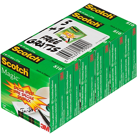 A green box of tape rolls with "Scotch Magic" and "Free" on it. A pen is on the package.