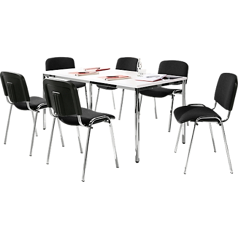 Conference table with six black chairs. Papers and a glass are on the table.