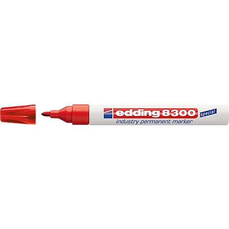 Close-up of a red Edding marker. The pen is partially visible with a cap, next to the lettering.