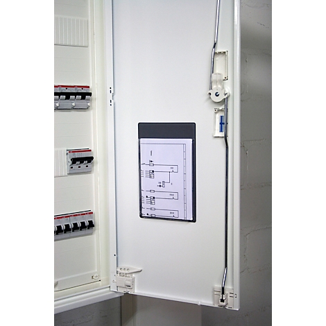 Open fuse box with diagram, fuses and wiring. Bright housing with screwed door.