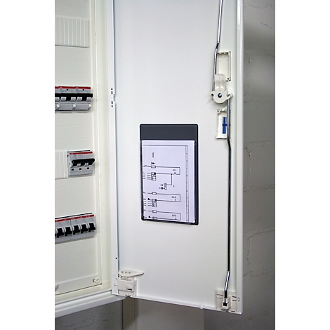 Open fuse box door, with wiring diagram and fuses, the door is white, the background light gray.