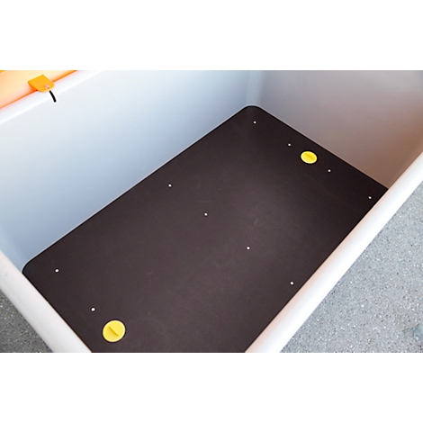 Dunkelbraune Platte in einer weißen Box, gelbe Kreisschrauben.