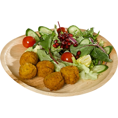 Teller mit Falafel, Salat, Tomaten, Gurken und Granatapfelkernen.