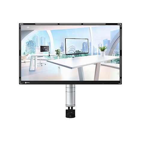 Ein schwarzer Monitor zeigt eine Büroszene. Er steht auf einem silbernen Ständer vor weißem Hintergrund. Im Monitor sind ein Schreibtisch, Fenster und Pflanzen zu sehen.