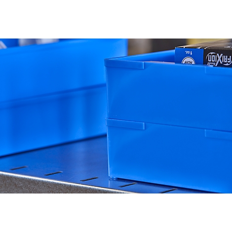 Two blue containers on a metallic surface. Pens are visible in one container.