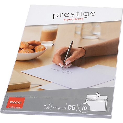 Person writing on paper with a pen. Baked goods, drinks and paper are on the table. "prestige" is at the top.