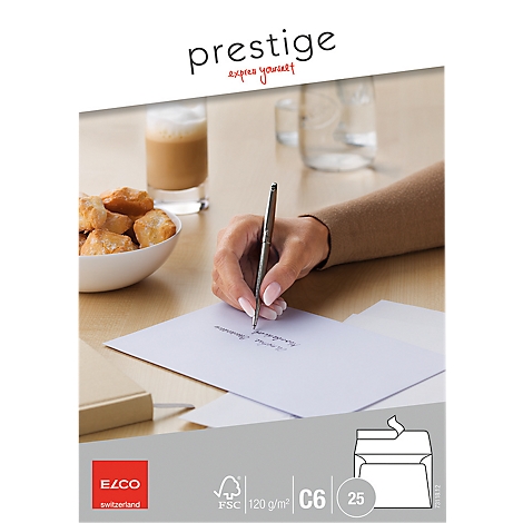 A person writes with a pen on a piece of paper. On the table are coffee, pastries, and envelopes.