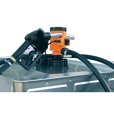 Close-up of a fuel pump with a black nozzle, orange pump, and hoses on a metal tank.