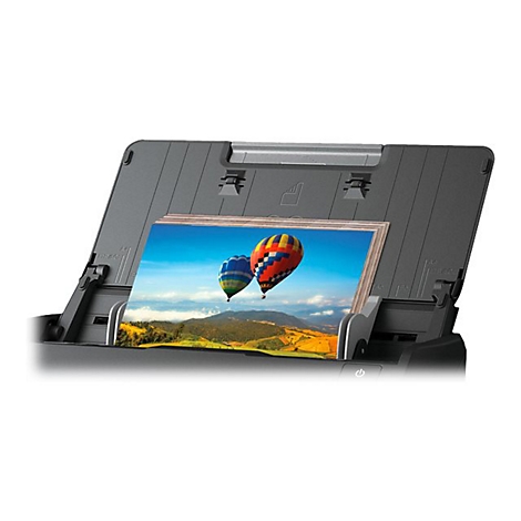 Schwarz-grauer Scanner mit Foto von Heißluftballons. Gerät scannt das Bild.