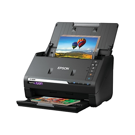 Scanner Epson noir avec couvercle ouvert; une image de montgolfiÃ¨res est en cours de numÃ©risation.