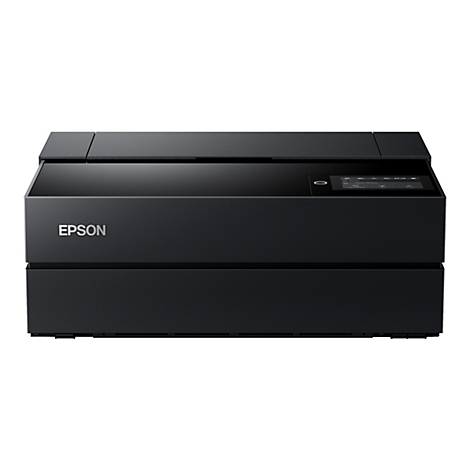 Imprimante noire avec le logo EPSON. Il y a une surface plane sur le dessus. Un Ã©cran sur le cÃ´tÃ©.