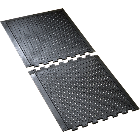 Two black rubber mats with a diamond pattern, connected by a zigzag pattern.