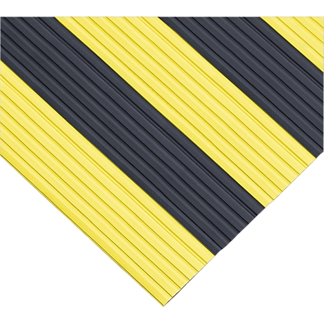 Yellow and black grooved corner protection element, diagonal stripes, detail shot, corner protection