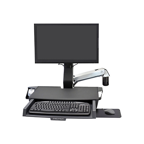 Ein schwarzer Monitor, Tastatur und Maus auf einem höhenverstellbaren Schreibtisch. Der Tisch hat das Logo "Ergotron".