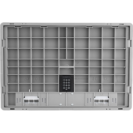 Grijze koffer, interieur met raster, zwart toetsenbord.