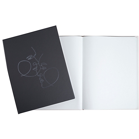 Schwarzes Notizbuch mit weißer Strichzeichnung von Gesichtern. Geöffnete, leere Seiten.