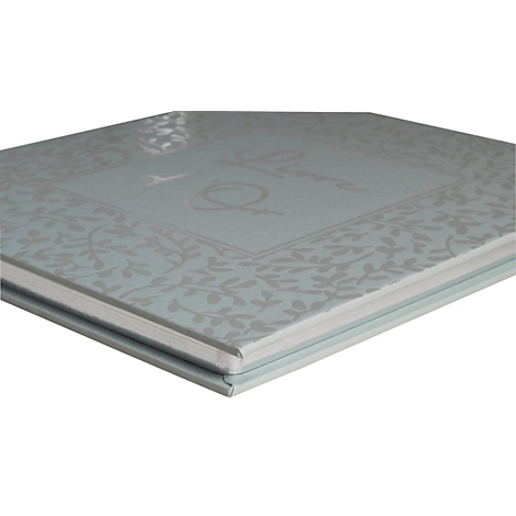 Livre bleu clair avec motif floral et lettrage. Les pages sont blanches, la couverture est lisse.