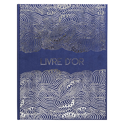 Livre bleu avec motifs de vagues argentées et l'inscription 'LIVRE D'OR'.