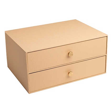Beige juwelendoos met twee lades en gouden knoppen.