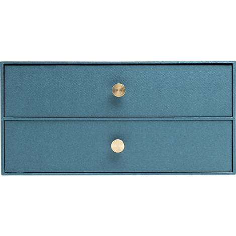 Close-up van een blauwe lade met twee niveaus en gouden knoppen.