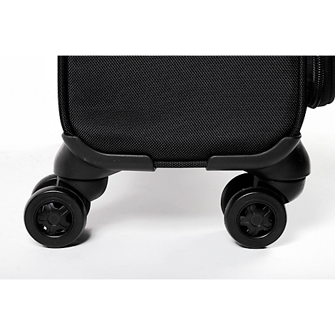 Gros plan : Roues de valise noires avec des surfaces texturées sur fond clair.