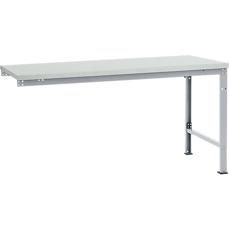 A white workbench with grey metal legs. The table is attached to the wall and has a minimalist design.