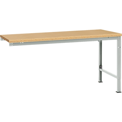 A workbench with a light brown table top and a gray metal frame. The table is partially attached to the wall.