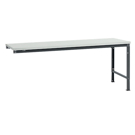 Long, gray workbench with metal frame. One side with wall mount, the other with two legs and struts.