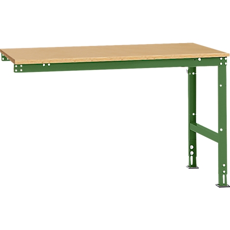 Green workshop table with wooden top. It has a stand and is fixed to the wall.