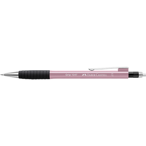A pink Faber-Castell ballpoint pen, with a black grip and silver clip. There is writing on the pen.