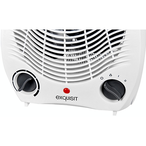 Close-up of a white fan heater with two black dials and a red light. The 'exquisit' logo is visible below.