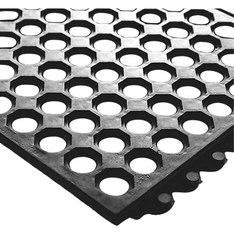 Black rubber mat with honeycomb-shaped holes. The background is white.