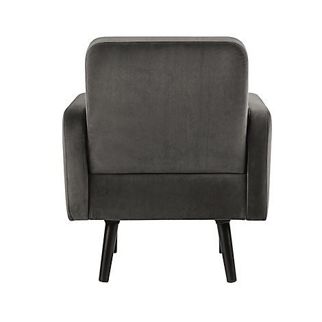 Grijze fluwelen fauteuil van achteren, met zwarte poten.