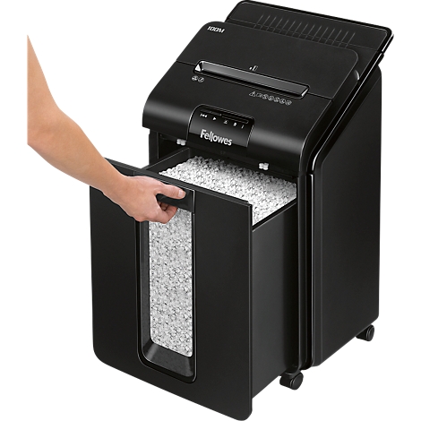 A black paper shredder machine, the collection bin is being opened. Fellowes is written on the bin.