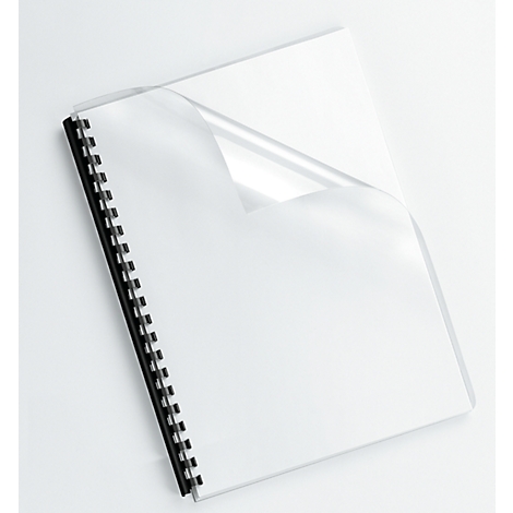 A white notebook with a black spiral binding and a transparent protective film, which is slightly lifted.