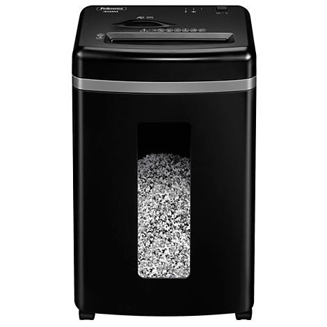 Black paper shredder with visible shredded material. Silver stripe in the middle. Control panel on top.