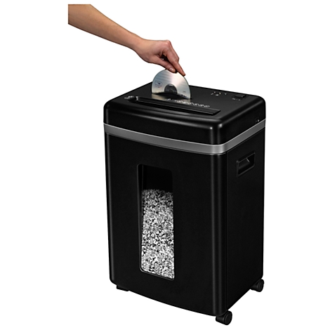 A hand places a CD into a black shredder. Shredded paper is visible in the window.