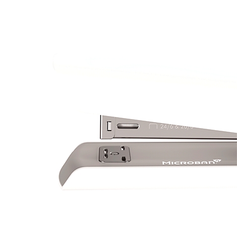 A silver stapler close-up, showing parts and "MICROBAN" text, against a white background.