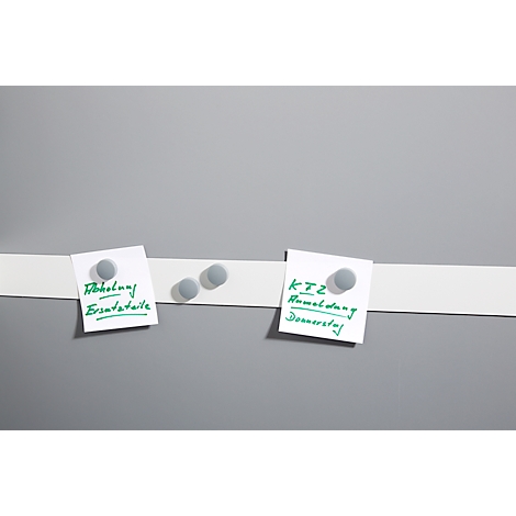 Grey board with white stripe, on which two note pads with green writing adhere. One shows "Collection spare parts", the other "KTZ registration Thursday".