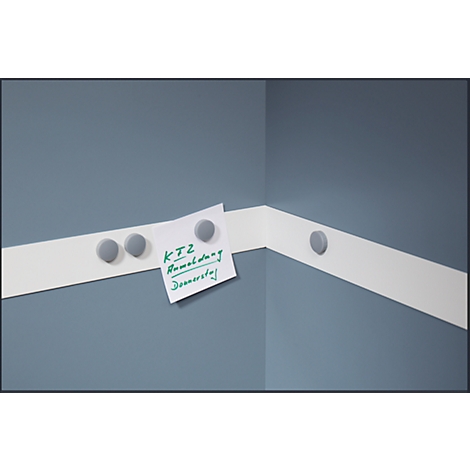 Corner with white tape, with a note attached by gray magnets. Note: KTZ Remodeling Thursday.