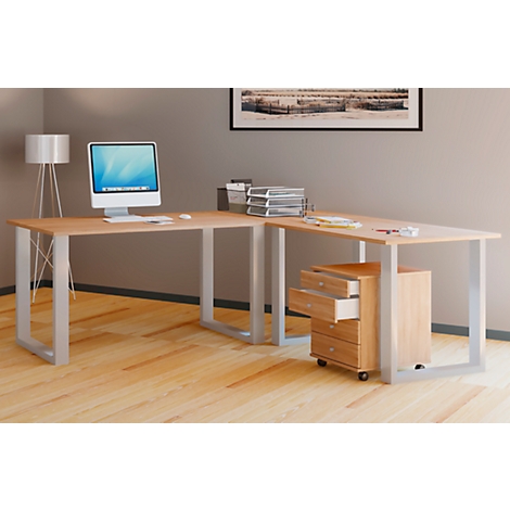 Light wood desk with computer monitor, rolling cabinet, and lamp.