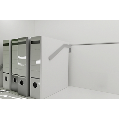 Three gray folders stand in a corner. A gray bracket is attached to the wall on a white surface.